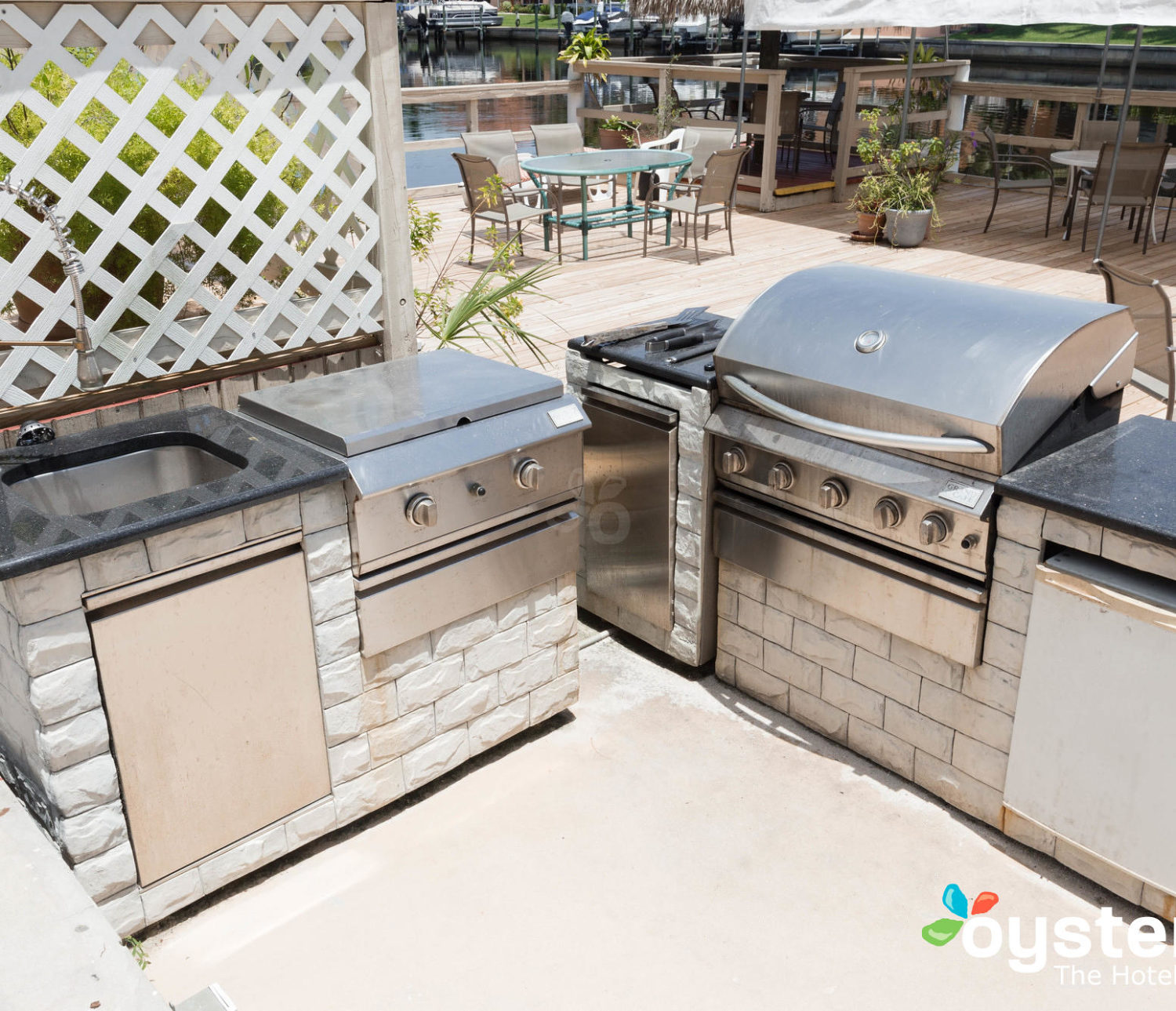 Hideaway Hotel - grill area and dock with table and chairs