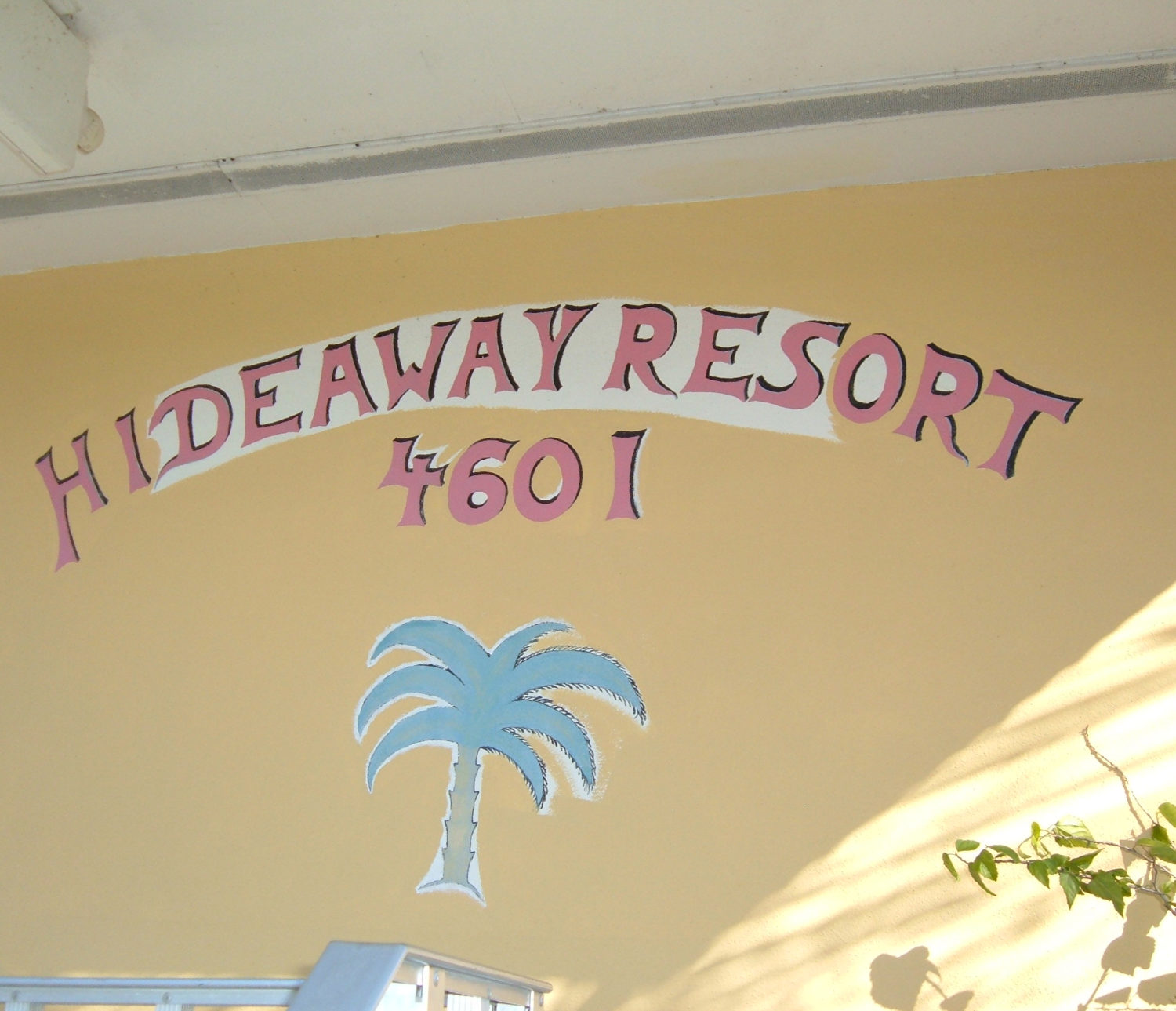 Hideaway Hotel - address and name painted wall mural