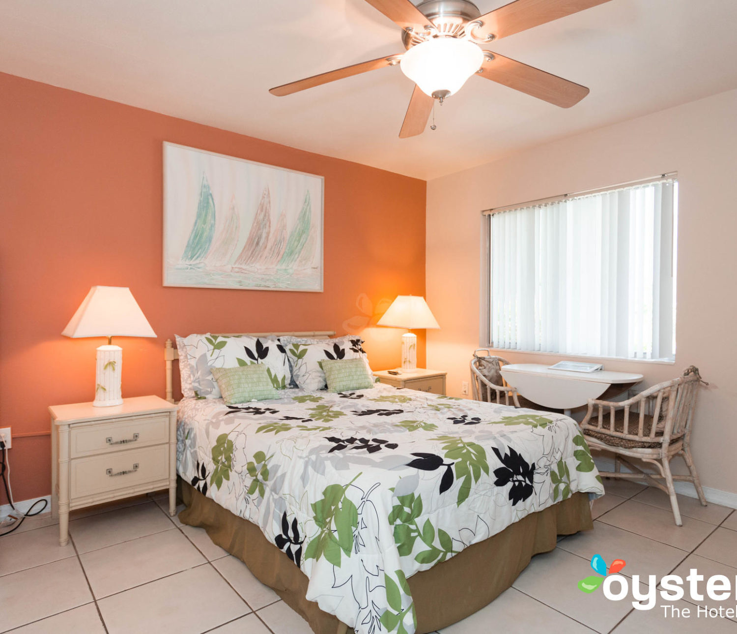 Hideaway Hotel - guest room bed and window view with seating