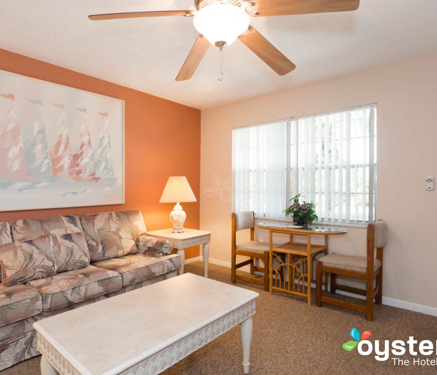 Hideaway Hotel - king suite living room area, window view with seating